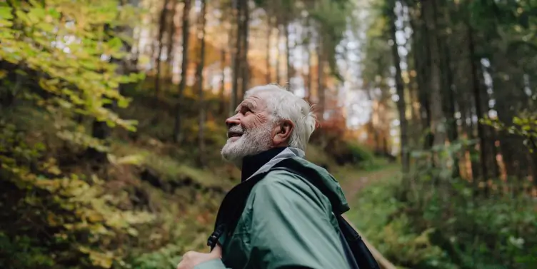 Man on adventure holiday in a forest.