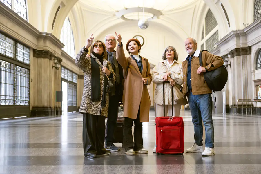 A group of senior travellers in the airport